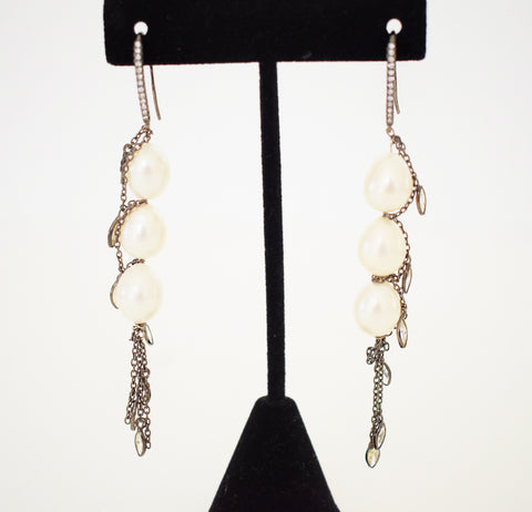 Oval pearl earrings with dangling CZs